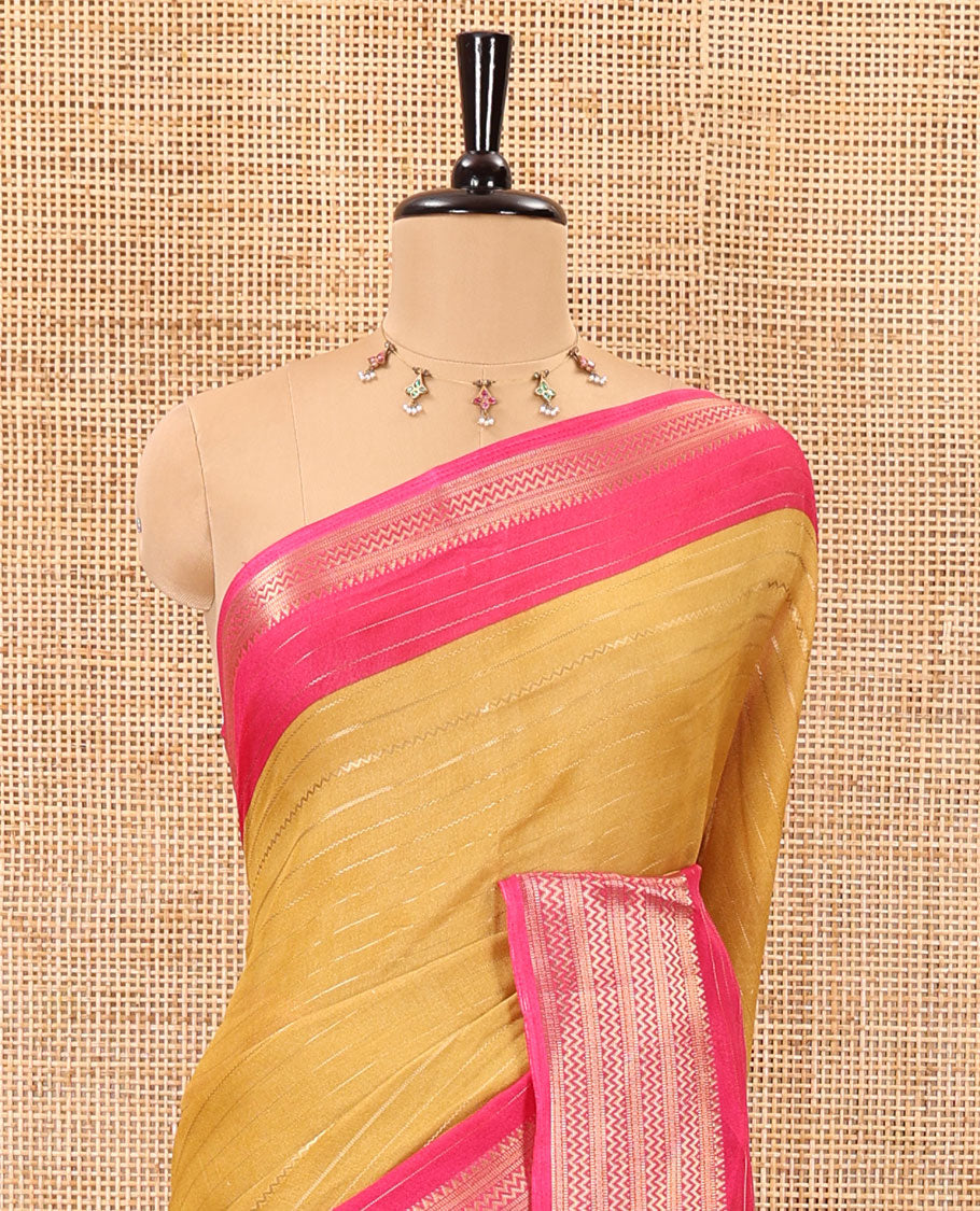 Gold horizontal zari striped moss chiffon saree, contrast traditional zari border, striped pallu, and a contrast zari design blouse