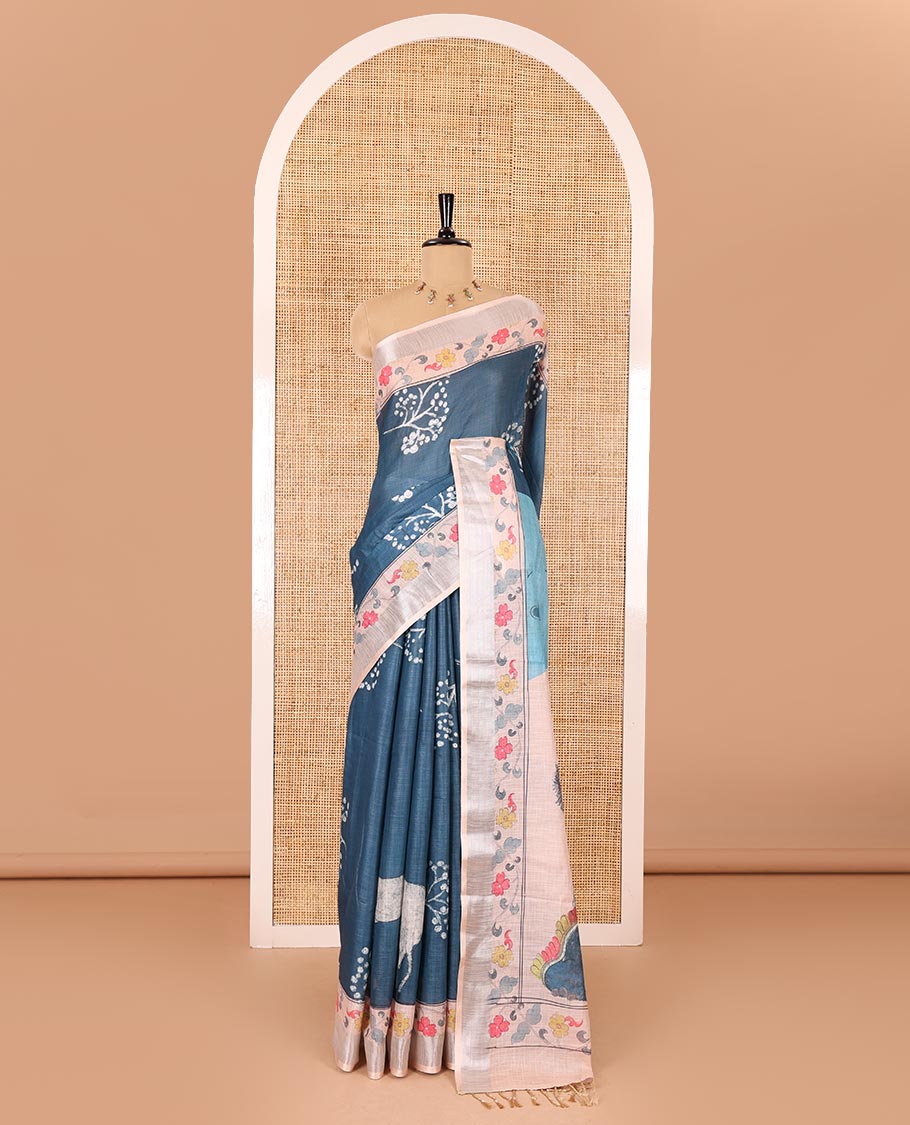 Blue floral and deer motifs printed Linen cotton saree, contrast zari border of floral creeper print, flora-fauna printed pallu, and floral motifs printed blouse