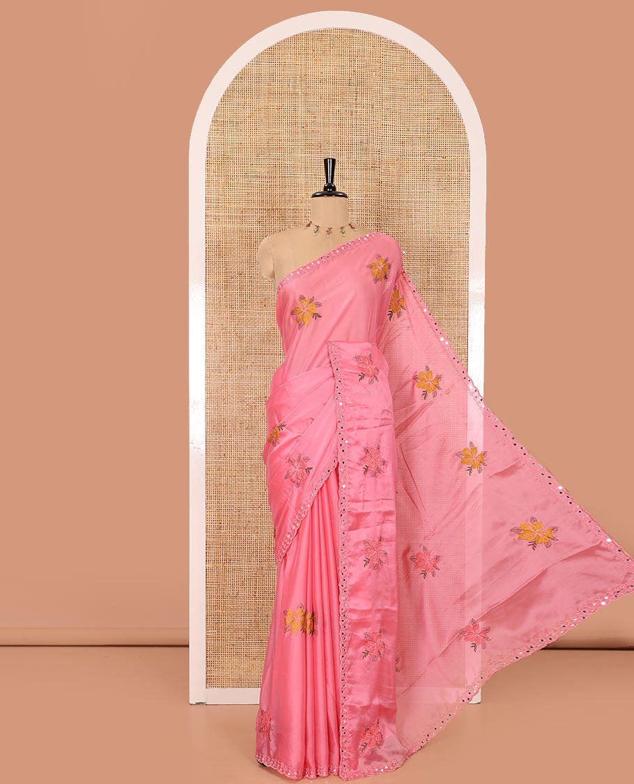 Pink floral motifs embroidered rangoli chiffon saree with mirror work border, embroidered pallu, and a contrast intricate scallop design embroidered blouse
