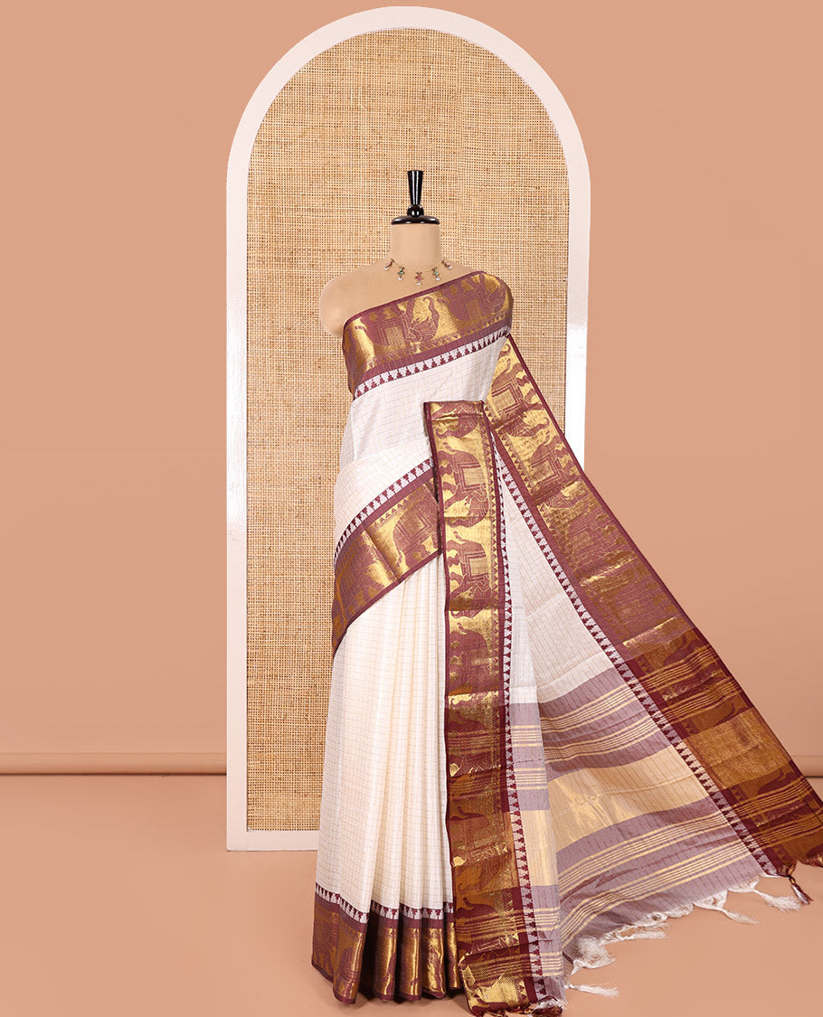 White Semi-Taffeta Saree, Adorned with Medium-Zari Checks All Over Its Body, Complemented by Contrast Temple Border Featuring Elephant Motifs, Contrast Checked Pallu, and Paired with a Matching Blouse