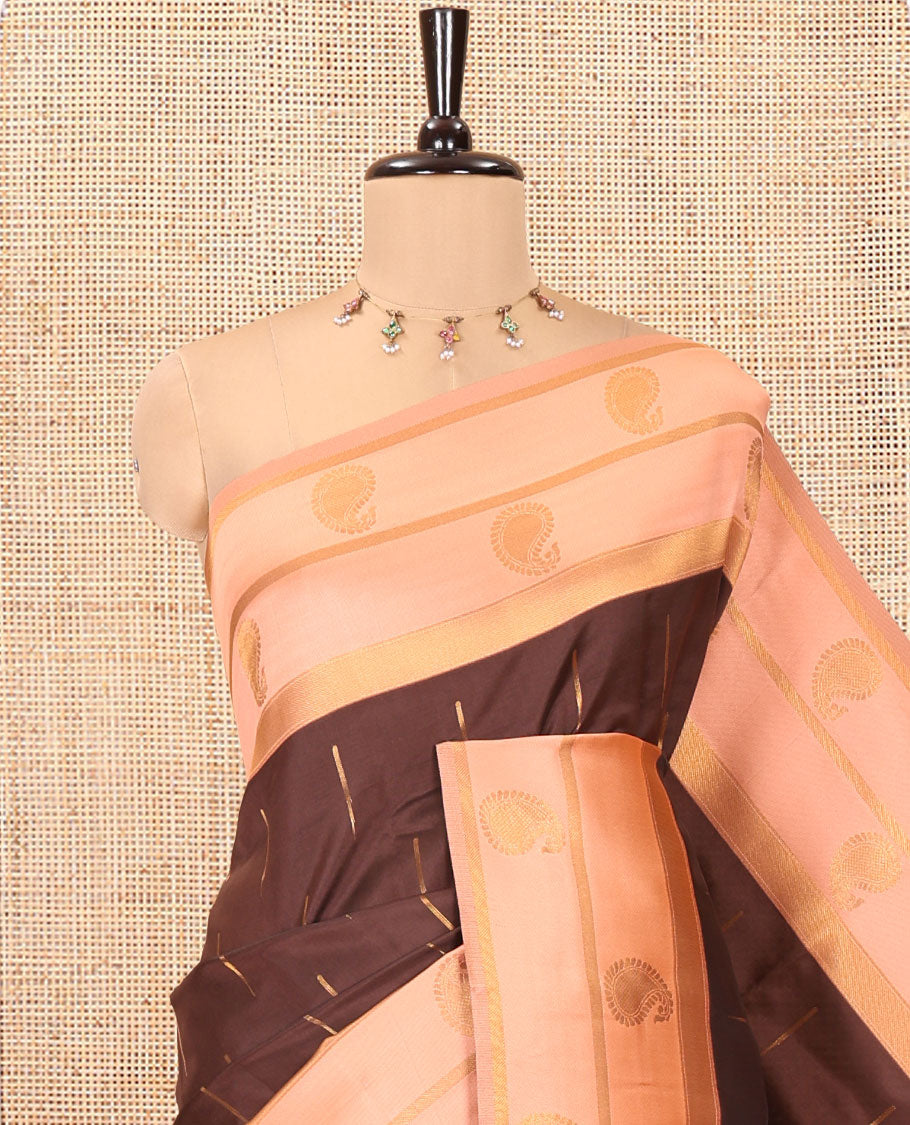 Brown and Peach Kanchi Silk Saree, Elevated with Zari Buttas All Over Its Body, Complemented by a Contrast Border of Paisleys, Zari-Striped Pallu, and Paired with a Contrast Jacquard Blouse