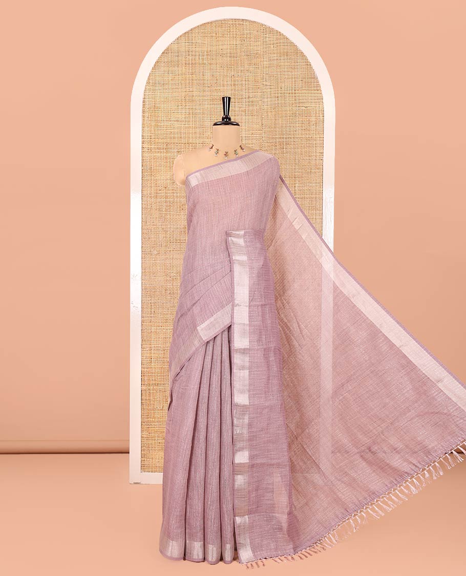 Lavender Linen Zari Cotton Saree, Gleamed Up with Zari Stripes All Over Its Body, a Subtle Zari Border, a Self-Pallu, and Comes Without a Blouse