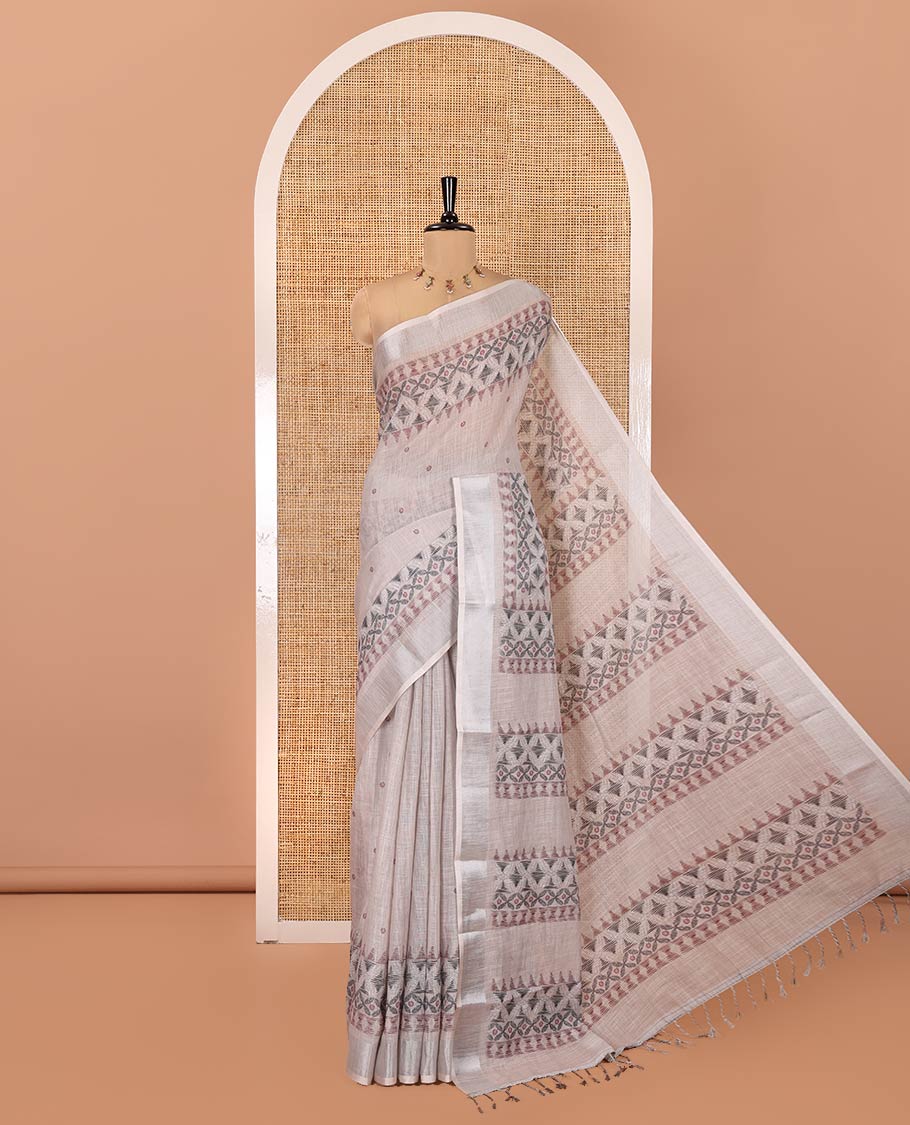 Chikku Linen Saree, Decorated with Buttas and Geometric Print on Its Body, Highlighted by Zari Bavanji Border, Pallu of Same Geometric Print, and Paired with a Contrast Blouse