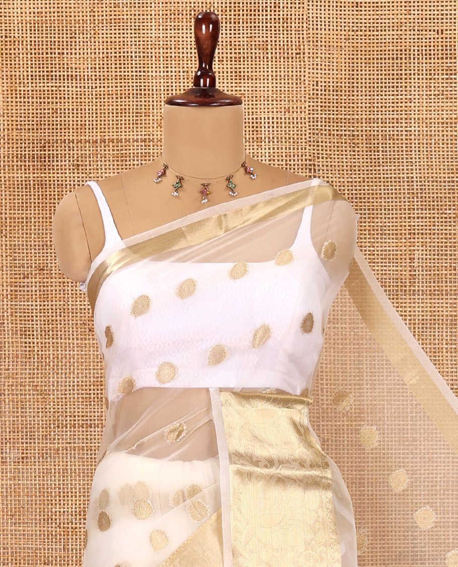 Cream Semi-Organza Saree, Charmingly Accented with Zari Buttas, Highlighted by a Zari Floral Creeper Border, and a Matching Blouse