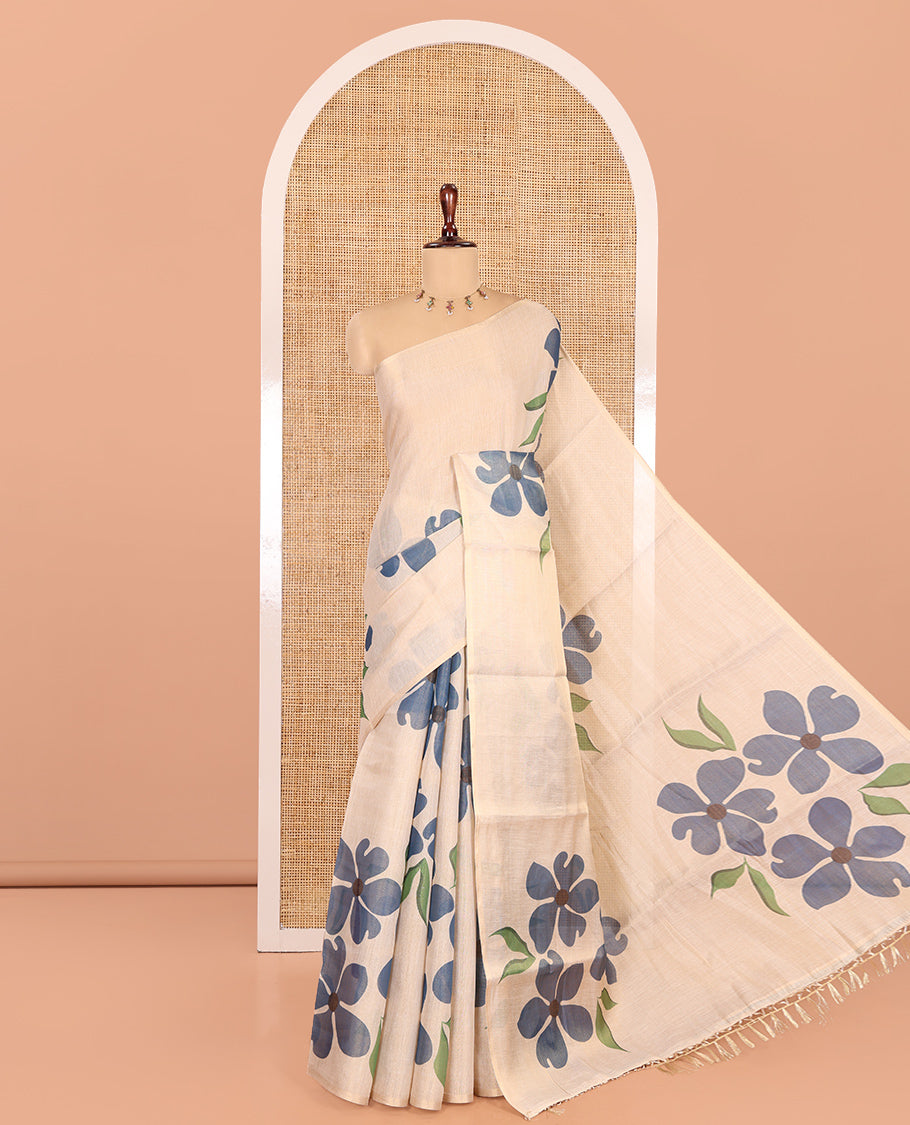 Borderless Cream-Blue Tissue Saree Features Floral Print, a Floral Printed Pallu, and a Contrast Blouse