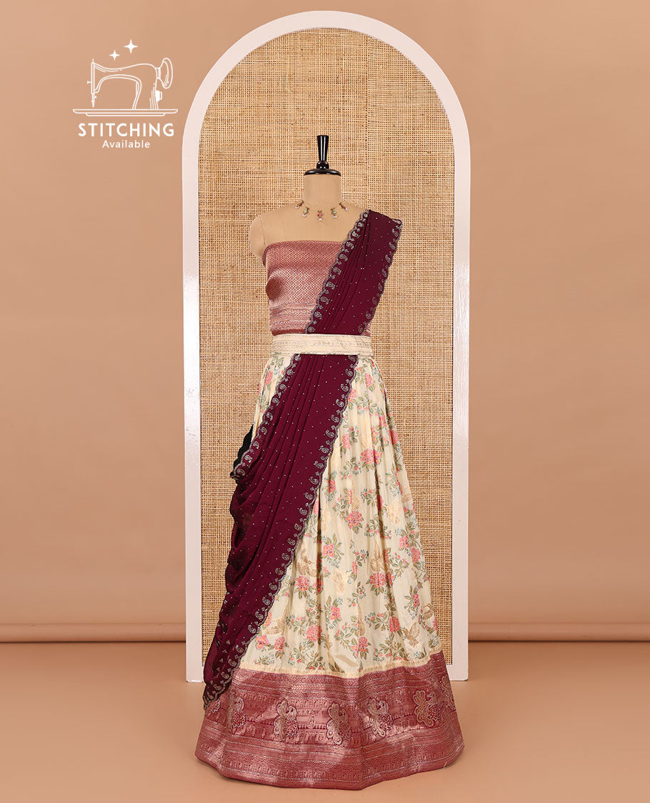 Cream and wine half-saree, floral and bird printed nylon viscose crepe top, contrast traditional zari and stone work border, jacquard banaras blouse, and scallop stone work dhavani