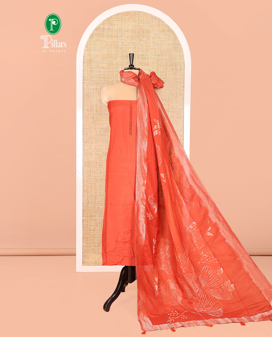 Rust Semi-Silk Material Chudidar Set, Adorned with Pom-Pom Necklined Top, a Plain Santoon Bottom, and Paired Floral Zari Woven Semi-Silk Dupatta