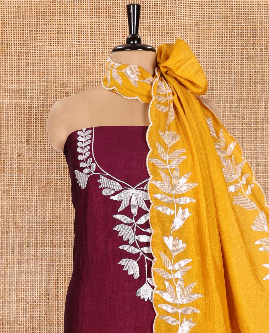 Wine Material Churidar Set, Detailed with Floral Motifs Sequins-Thread Embroidered on Its Vichitra Silk Top, Comes with a Contrast Santoon Bottom, and Paired with a Vichitra Silk Floral Embroidered Scallop Dupatta