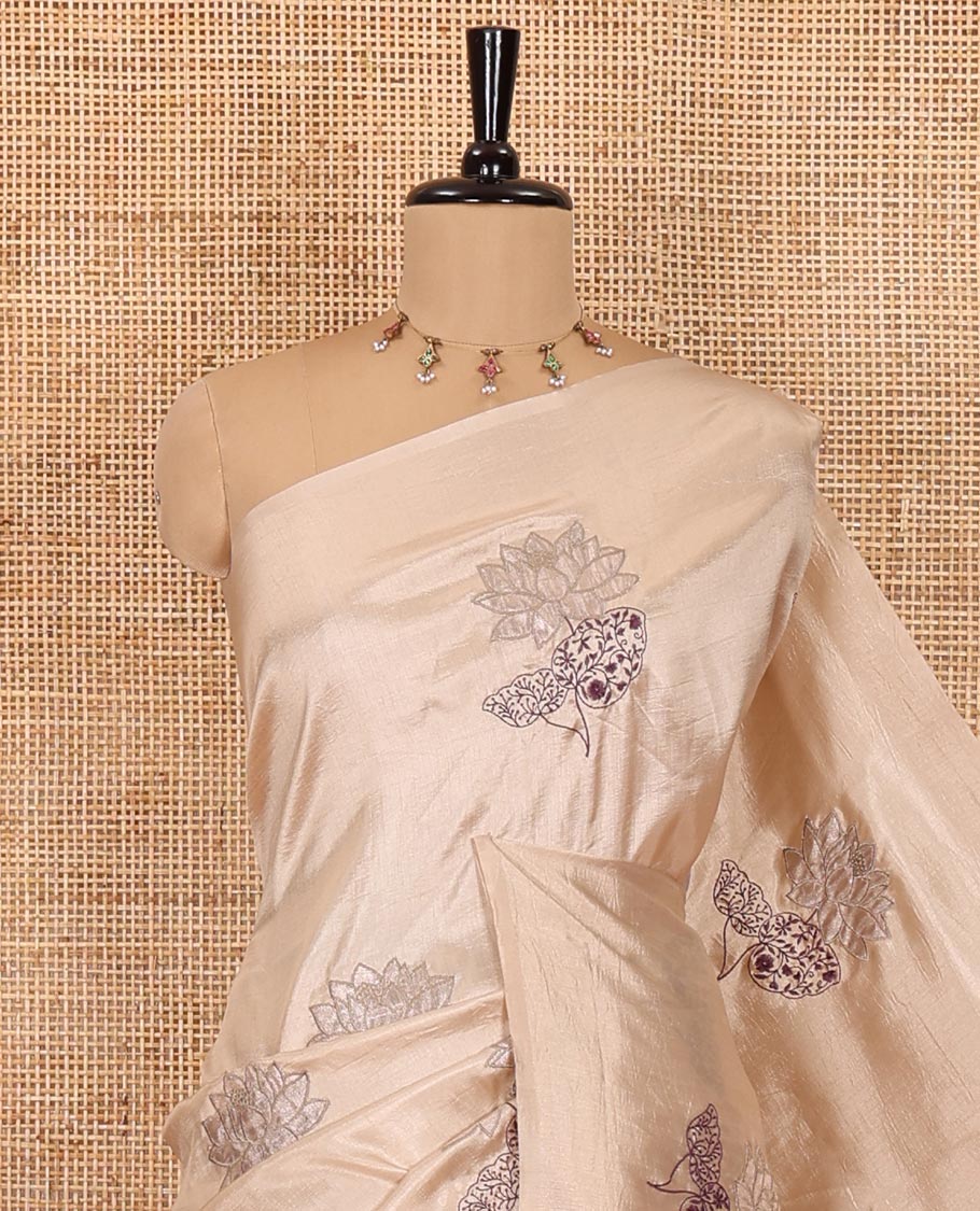 Borderless chikku floral motifs embroidered fancy tussar saree, floral motifs embroidered pallu, and a plain blouse