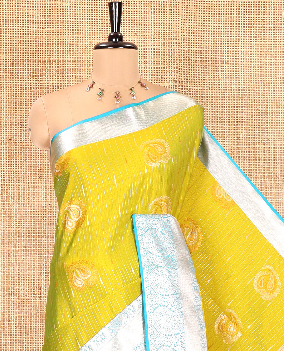 Parrot Green Semi-Soft Silk Saree, Elegantly Crafted with Vaira Oosi, and Paisley Buttas All Over Its Body, Complemented by Contrast Traditional Border of Paisleys, Intricately Designed Pallu, and Paired with a Contrast Blouse