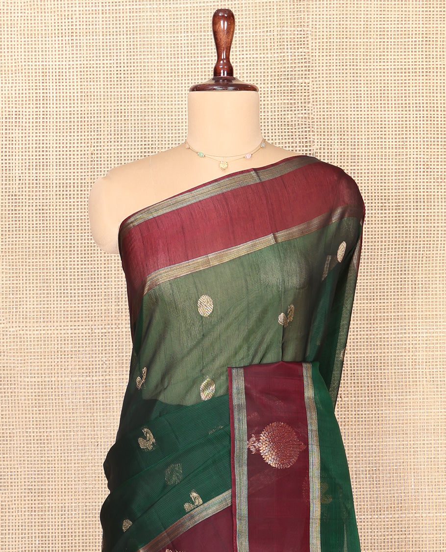 Green Silk Cotton Saree, Artfully Woven with Peacock and Rudraksham Motifs On Its Body, Complemented by Contrast Zari Motifs Woven Border, Geometric Zari Patterned Pallu and Paired with a Contrast Blouse