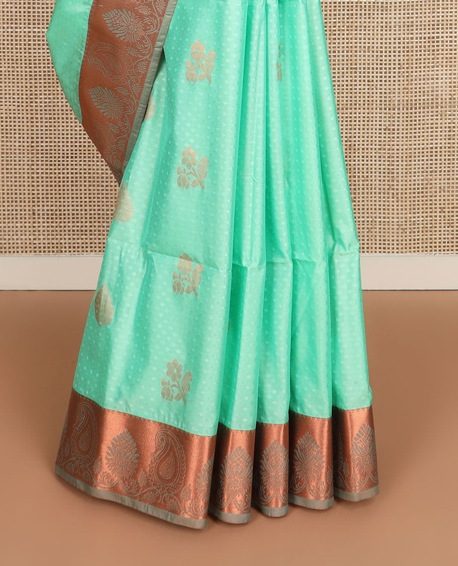 Green embossed and zari buttas soft silk saree, contrast paisley zari design border, and pallu of scallop designs