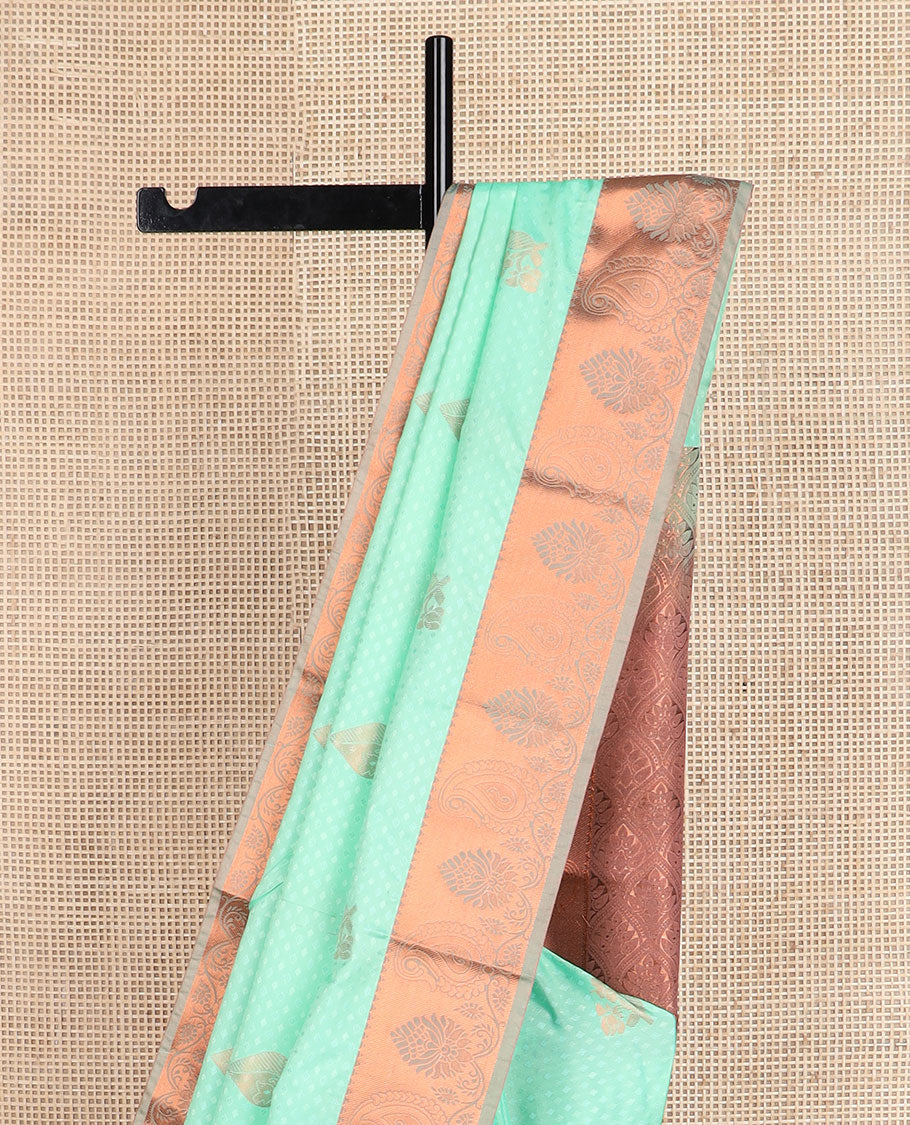 Green embossed and zari buttas soft silk saree, contrast paisley zari design border, and pallu of scallop designs