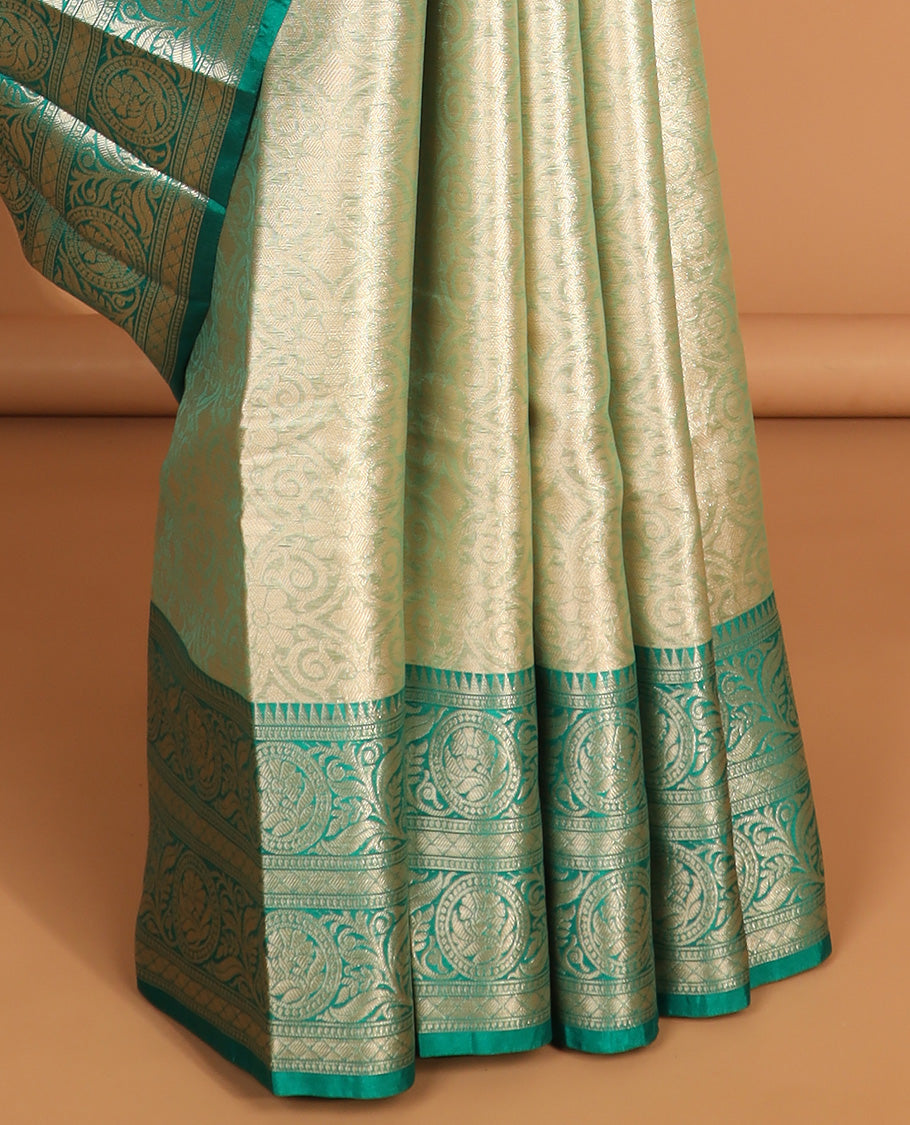 light green floral jacquard semi tissue saree with contrast floral zari design border & floral design pallu