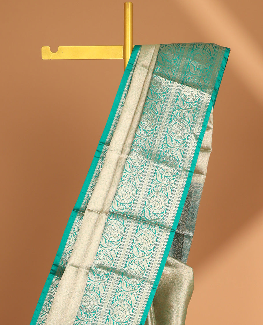 light green floral jacquard semi tissue saree with contrast floral zari design border & floral design pallu
