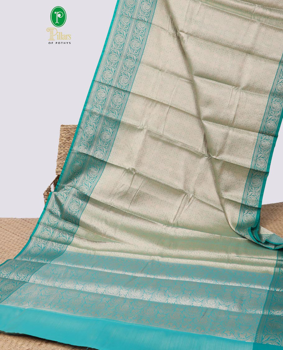 light green floral jacquard semi tissue saree with contrast floral zari design border & floral design pallu