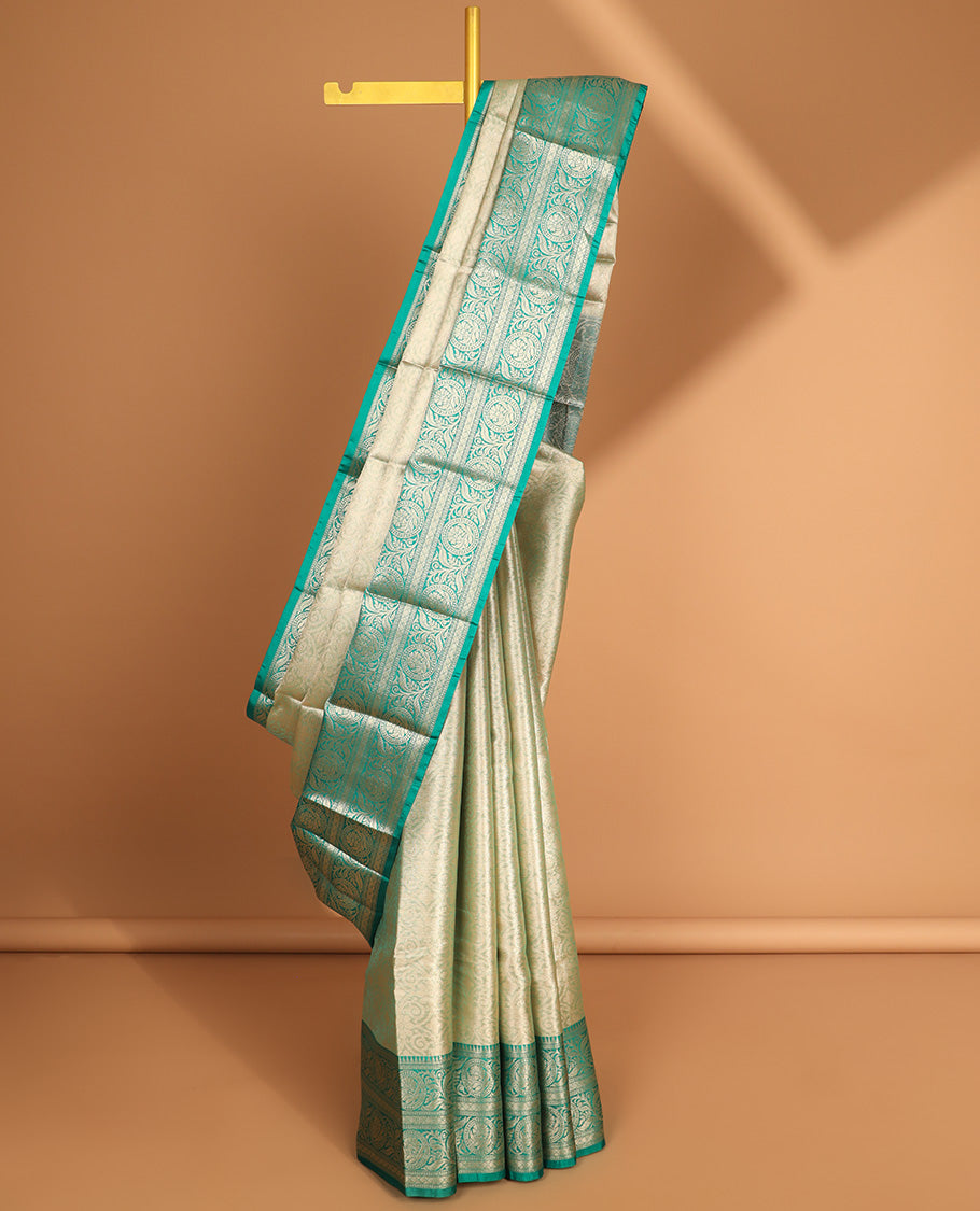 light green floral jacquard semi tissue saree with contrast floral zari design border & floral design pallu