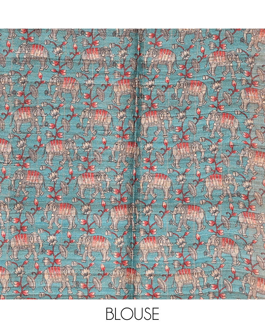 Borderless blue checked tussar saree, contrast pallu pictures pichwai cow, floral creeper, paisley, elephant, dancing kathak girl & swan figurines, with printed blouse