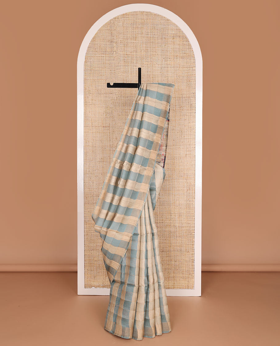 Borderless blue checked tussar saree, contrast pallu pictures pichwai cow, floral creeper, paisley, elephant, dancing kathak girl & swan figurines, with printed blouse