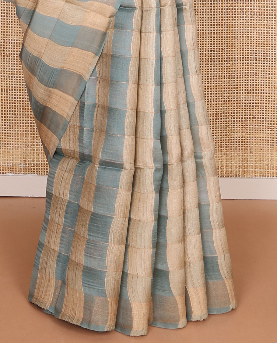 Borderless blue checked tussar saree, contrast pallu pictures pichwai cow, floral creeper, paisley, elephant, dancing kathak girl & swan figurines, with printed blouse
