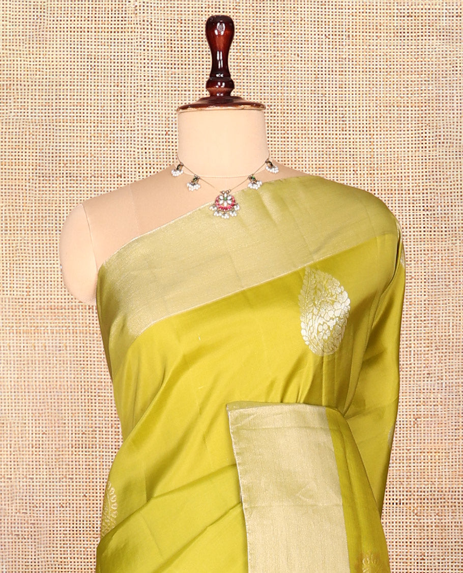 Green Semi Uppada Saree, Embellished with Zari Buttas, a Bavanji Border, Contrast Diagonal Leaf Vine Pallu, and a Contrast Blouse