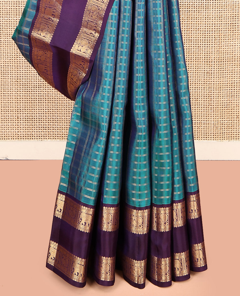Blue Vasundhara Lite Silk Mix Saree, Spotlighted with Checks, Complemented by a Contrast Rettai Pettu Border of Thilakam Mokku, Yaanai and Mayil Design, Jaal Pallu, and a Contrast Blouse