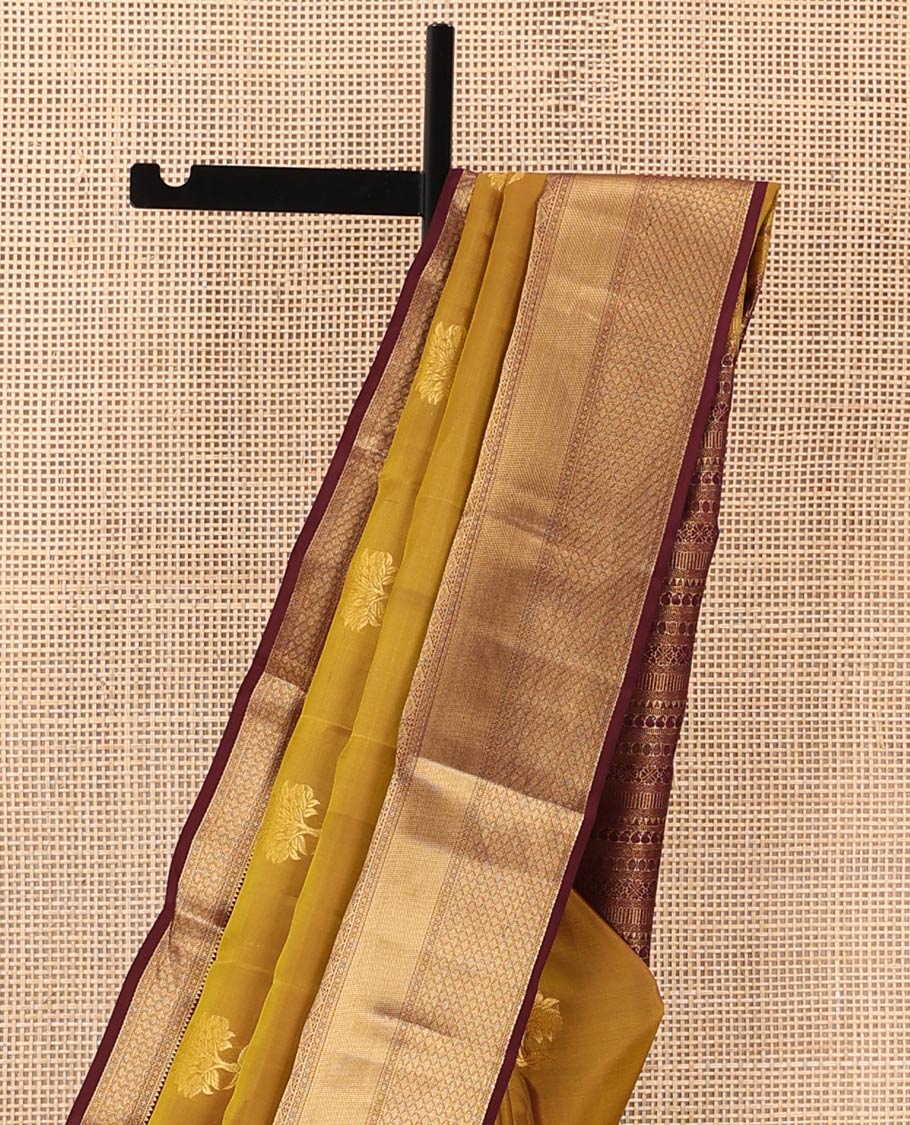 Green zari buttas Vasundhara silk mix saree, contrast border, and pallu steeped with traditional zari designs