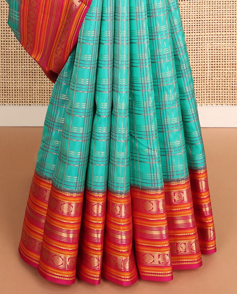 Green checked vasundhara elite silk saree with contrast traditional zari design border & intricate jaal design pallu