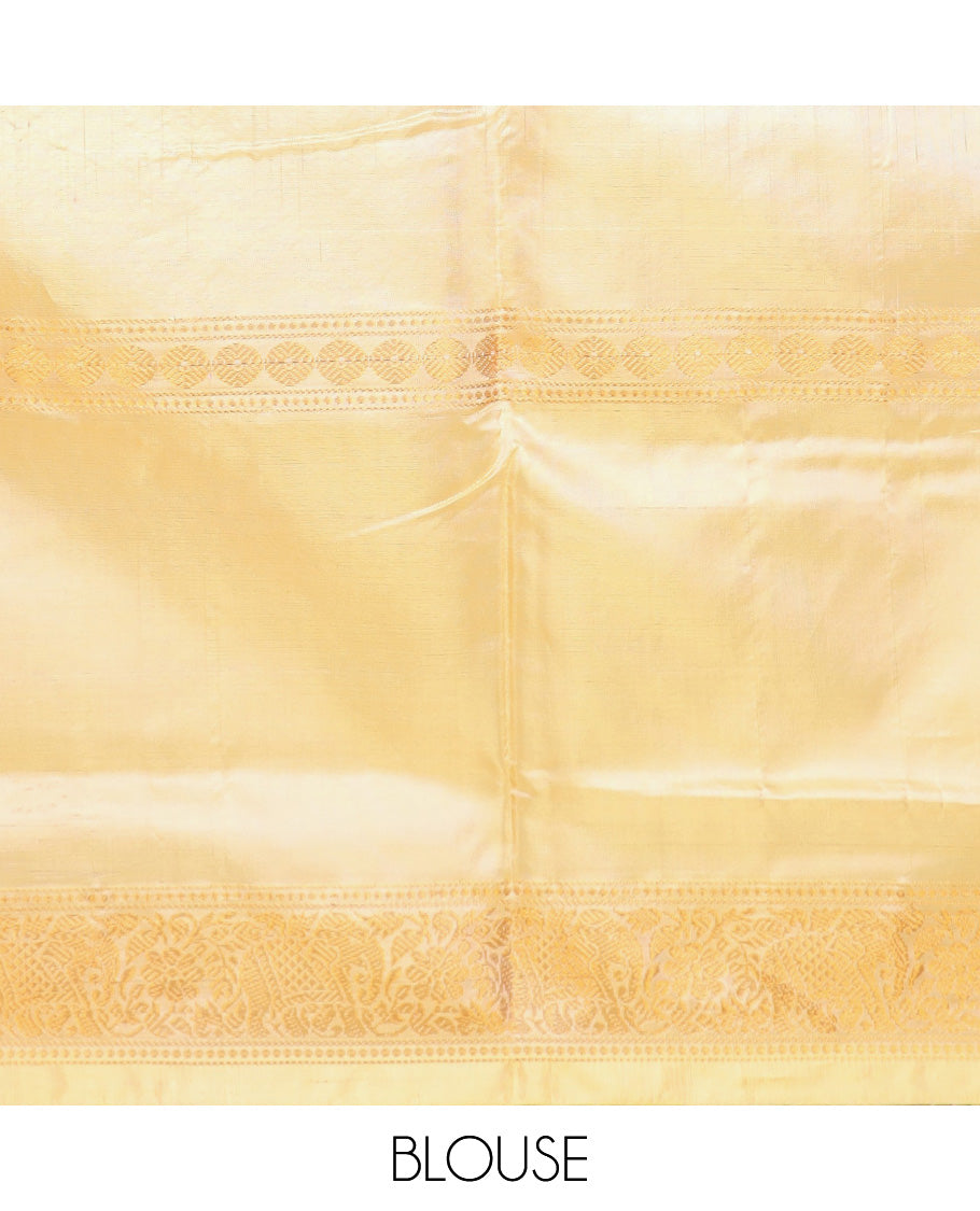 Peach jacquard banana pith saree, traditional zari border, and contrast pallu of stripes