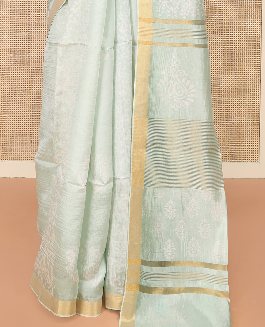 Pastel Green Banana Pith Saree Sparsely Sparkled with Intricate Motifs Printed All Over Its Body, Zari Bavanji Border, Pallu of Print and Zari Work, and Paired with a Matching Blouse