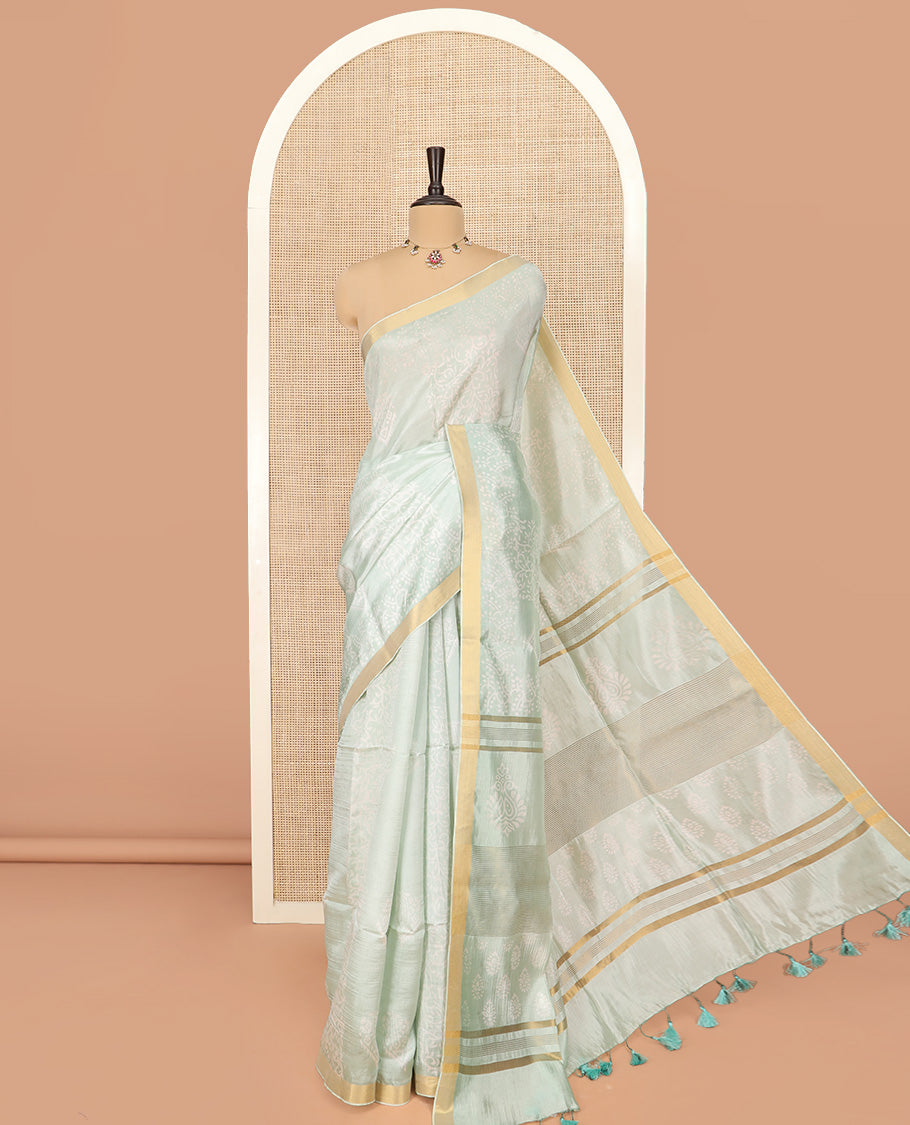 Pastel Green Banana Pith Saree Sparsely Sparkled with Intricate Motifs Printed All Over Its Body, Zari Bavanji Border, Pallu of Print and Zari Work, and Paired with a Matching Blouse