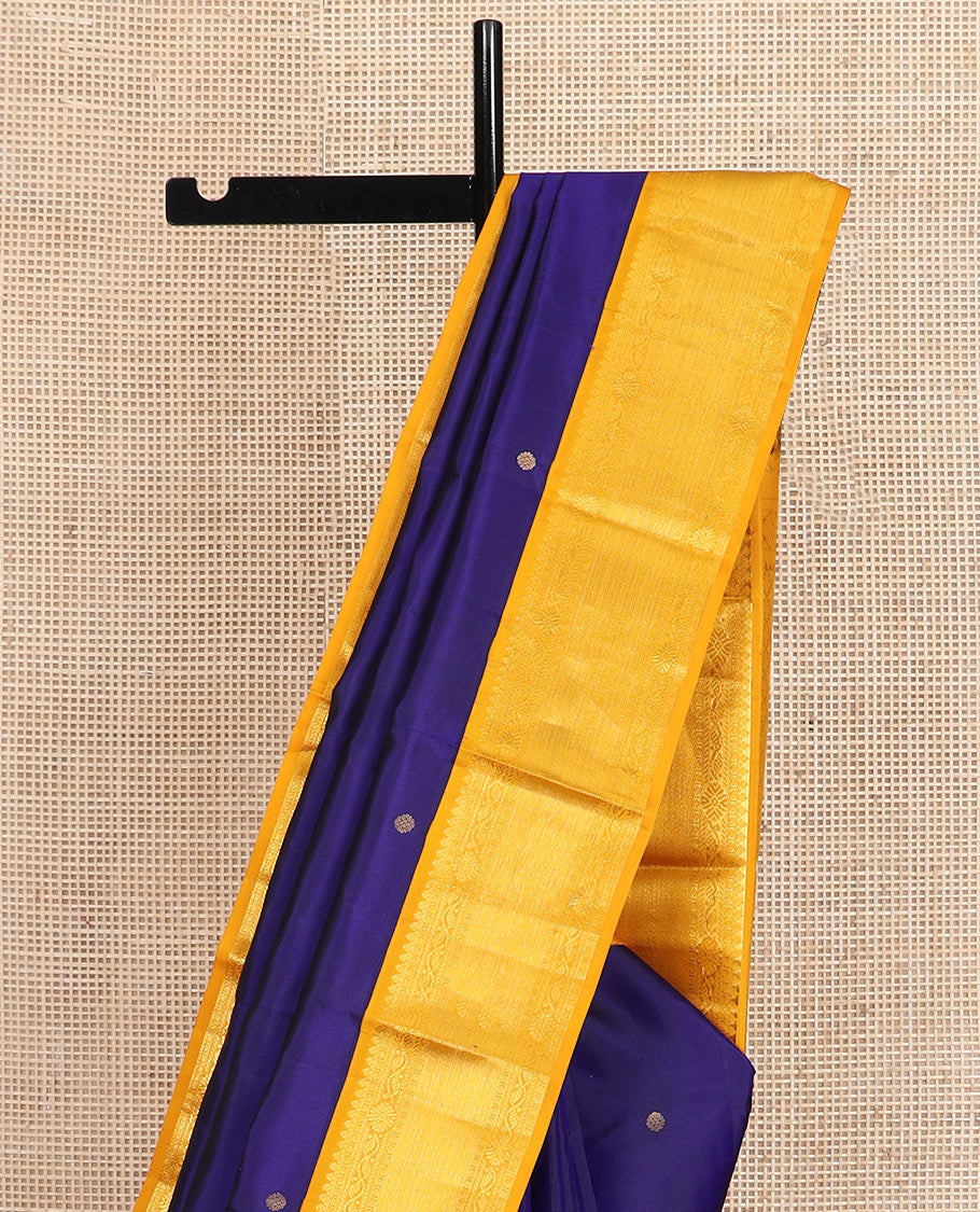 Blue zari buttas silk saree, contrast border of thilakam mokku, manga and floral designs, and jaal pallu