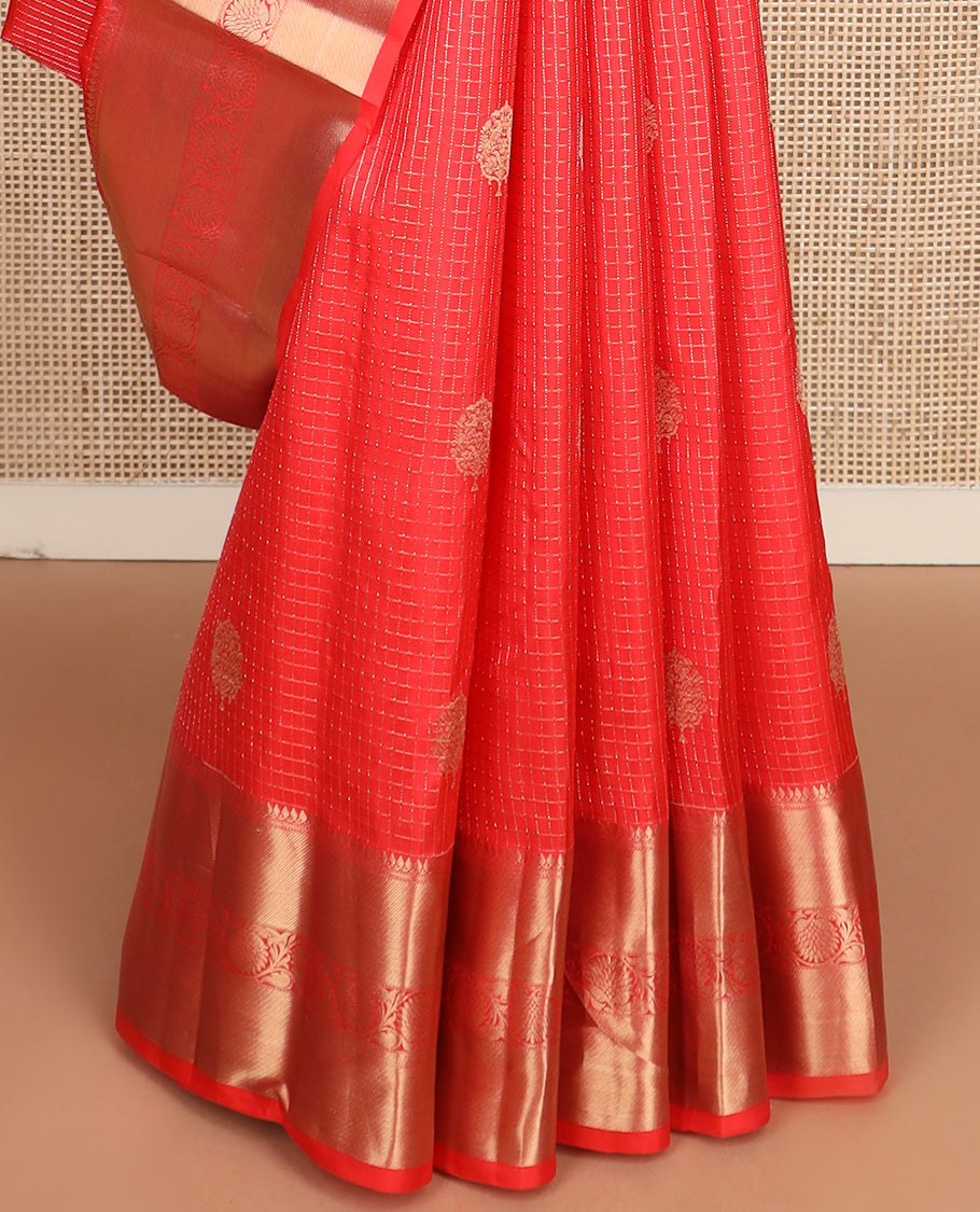 Red micro-checked and buttas silk saree, zari border of thilakam mokku, neli, zari stripes, and kodi visiry designs, and ogee patterned pallu