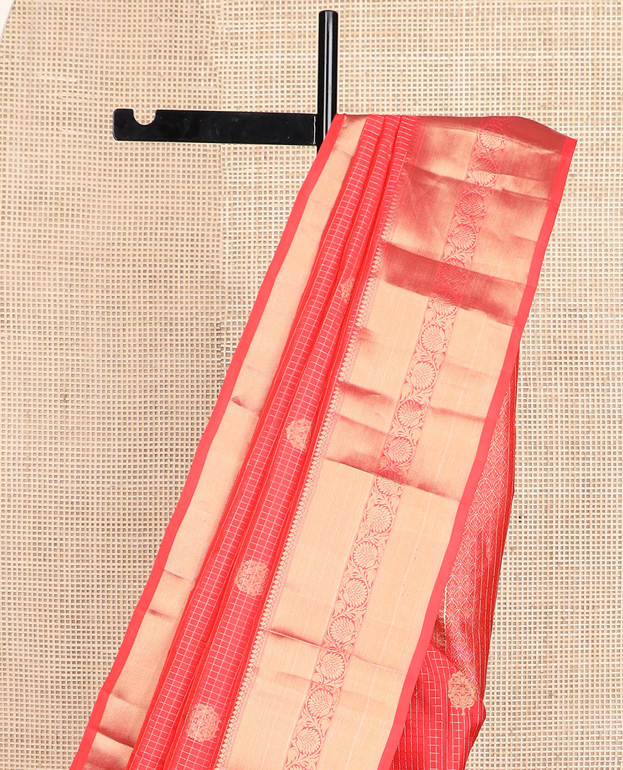 Red micro-checked and buttas silk saree, zari border of thilakam mokku, neli, zari stripes, and kodi visiry designs, and ogee patterned pallu