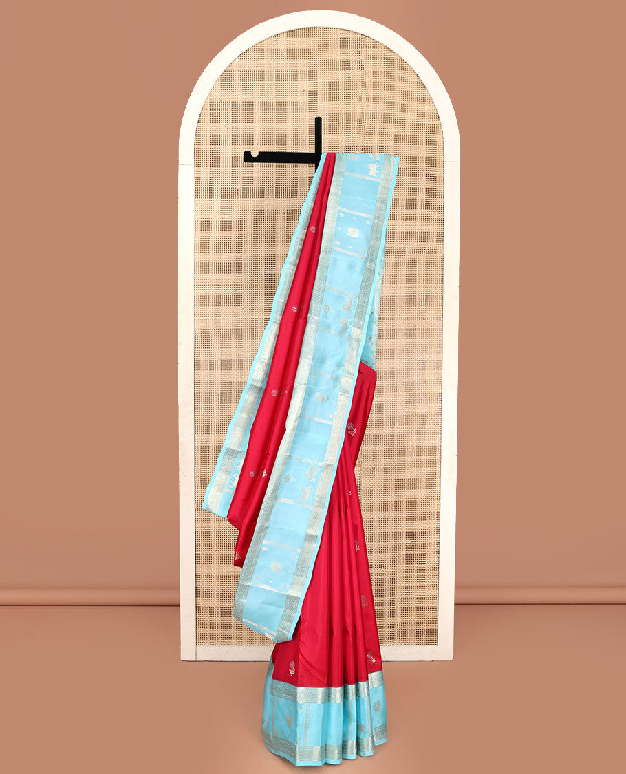 Red Vasundhara Silk Saree, Embellished with Floral Buttas on Its Body, Complemented by Contrast Border of Kodi Visiry, Annam, Pichwai Cow and Lotus Designs, Meticulously Crafted Pallu, and Paired with a Contrast Blouse