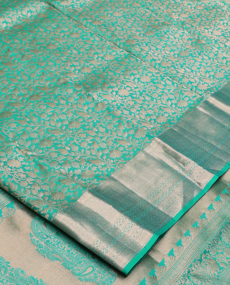 Turquoise jacquard Kanchipuram wedding silk saree, zari border of kathir, mayil kann, rettai neli, and lavangam kodi designs, and manga design pallu