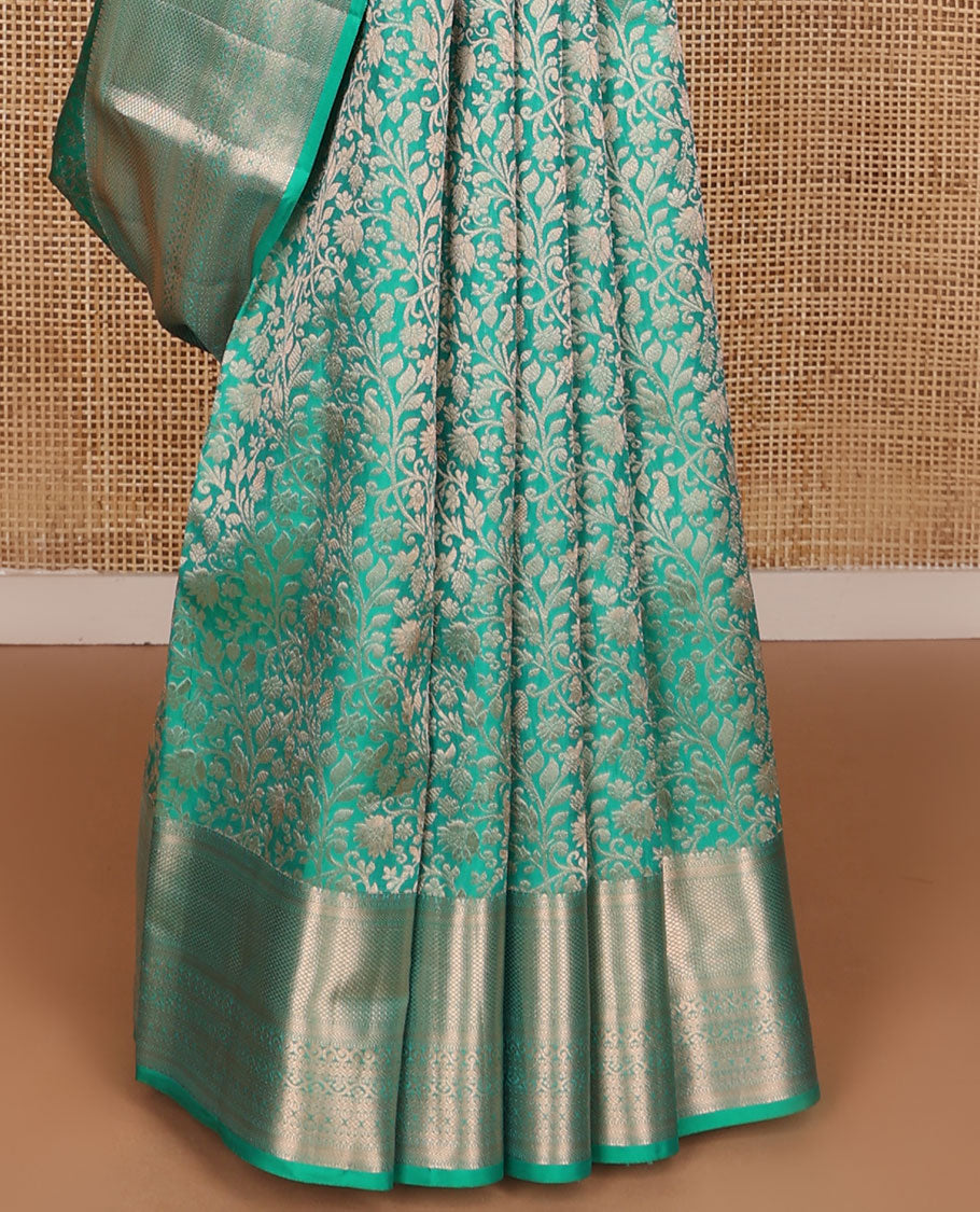 Turquoise jacquard Kanchipuram wedding silk saree, zari border of kathir, mayil kann, rettai neli, and lavangam kodi designs, and manga design pallu
