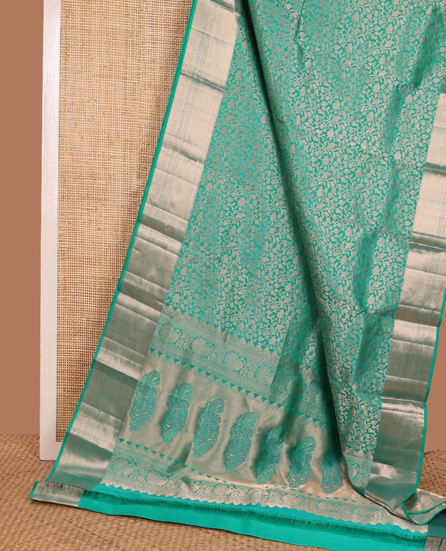 Turquoise jacquard Kanchipuram wedding silk saree, zari border of kathir, mayil kann, rettai neli, and lavangam kodi designs, and manga design pallu