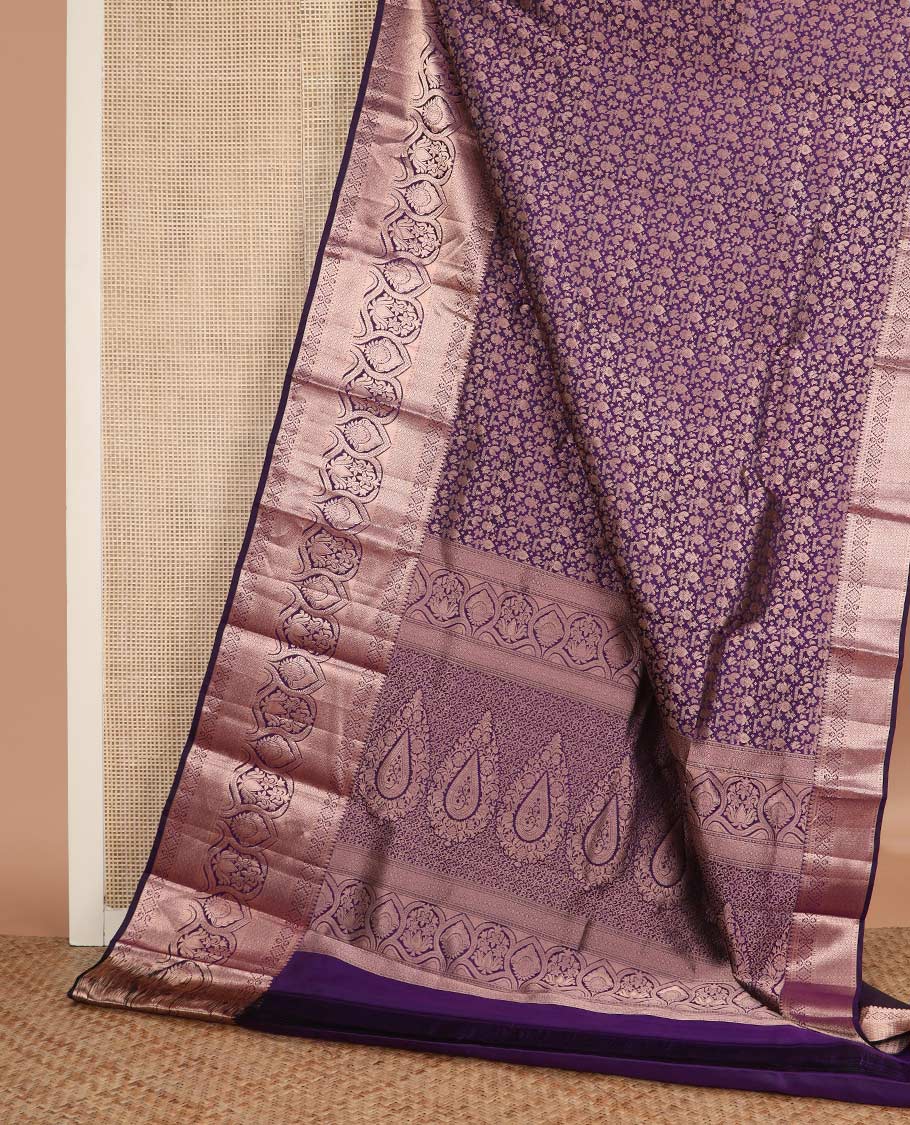 Purple jacquard wedding silk saree, zari border of thilakam mokku, muthu, diamond, jaal, and floral designs, and intricate pallu