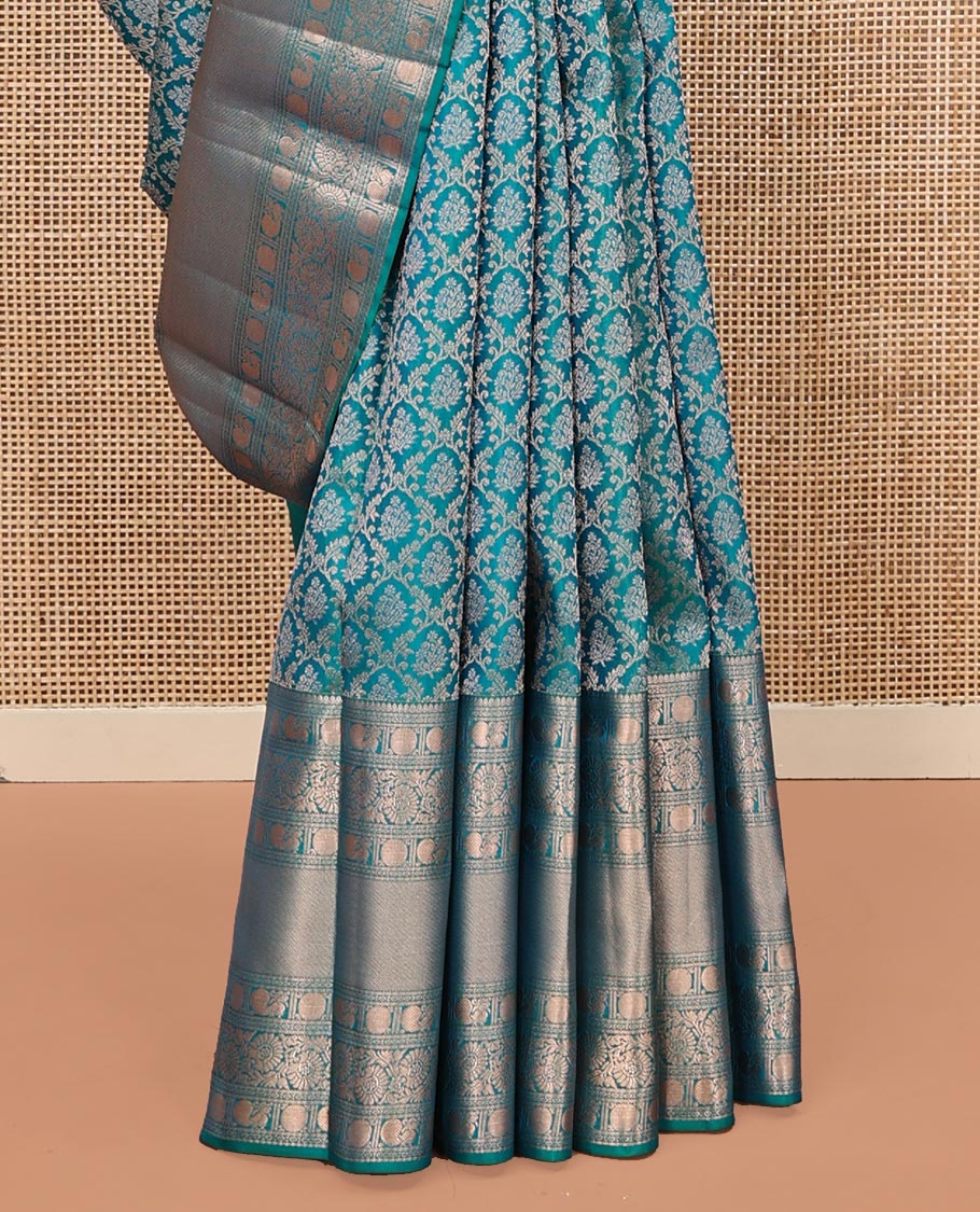 Rama Blue Kanchipuram Wedding Silk Saree, Mesmerized with Jaal Jacquard on Its Body, Highlighted by a Zari Border of Thilakam Mokku, Poun, Mayil, and Kodi Visiry Designs, Grand Pallu Steeped with Chakram Designs, and Paired with a Matching Blouse