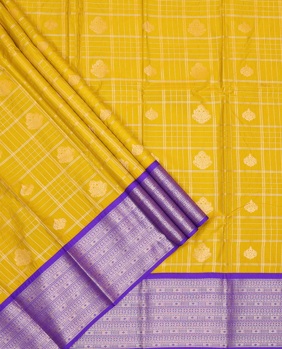 Mustard silk pavadai set, embossed, zari design with contrast traditional zari bordered skirt and a contrast zari design blouse