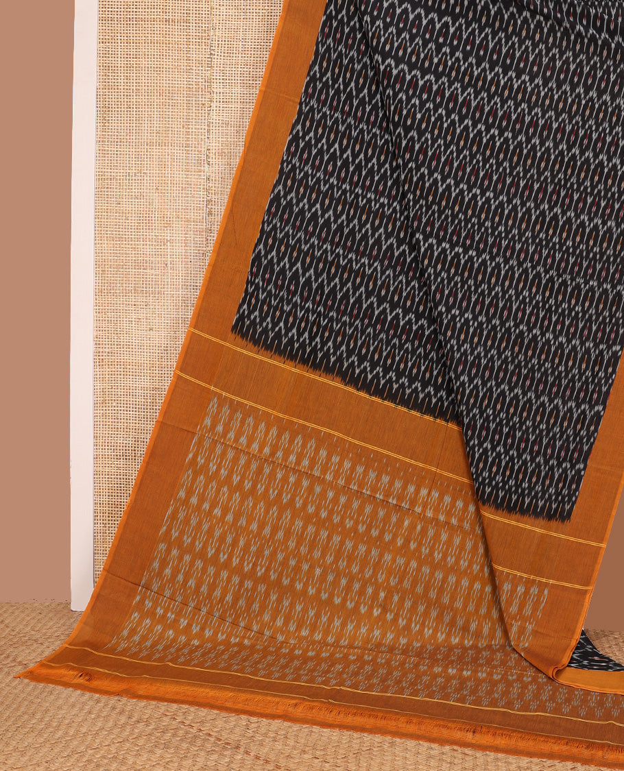 Black ogee patterned ikkat cotton saree, contrast plain border, and pallu of buttas