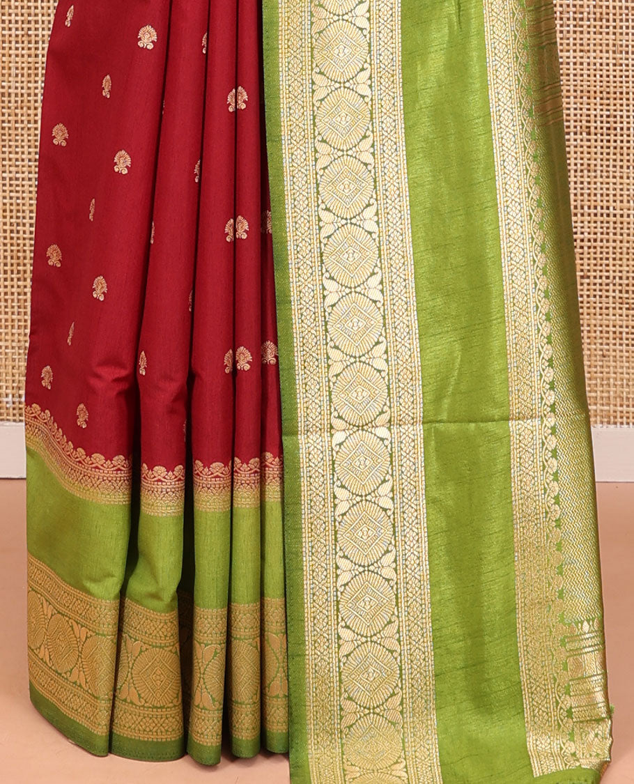 Maroon Dupion Silk Saree, Accentuated with Buttas All Over Its Body, Complemented by Contrast Traditional Border of Paisleys and Chakram Designs, Intricately Designed Pallu, and Paired with a Contrast Blouse