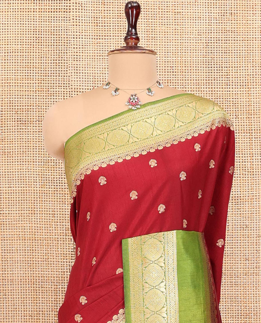 Maroon Dupion Silk Saree, Accentuated with Buttas All Over Its Body, Complemented by Contrast Traditional Border of Paisleys and Chakram Designs, Intricately Designed Pallu, and Paired with a Contrast Blouse