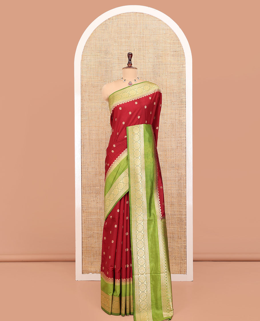 Maroon Dupion Silk Saree, Accentuated with Buttas All Over Its Body, Complemented by Contrast Traditional Border of Paisleys and Chakram Designs, Intricately Designed Pallu, and Paired with a Contrast Blouse