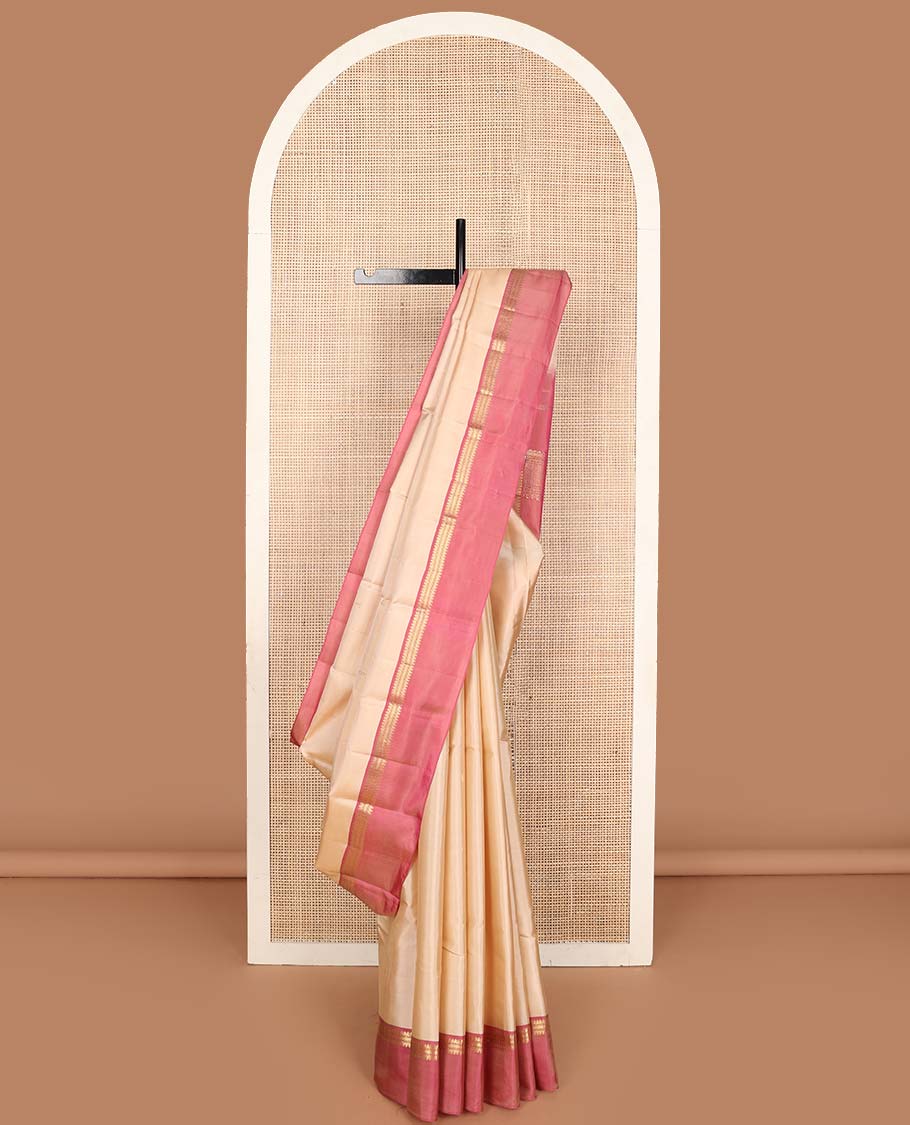 Cream buttas Kanchipuram silk saree, contrast kaal erangina border of thilakam mokku, muthu, and kathir designs and pallu of thilakam mokku, and kathir designs