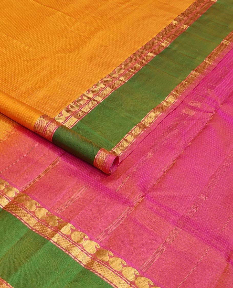 Yellow striped Kanchipuram silk saree, contrast ganga jamuna rettai pettu border of manga, banaras, and mayil kann designs, and zari striped pallu