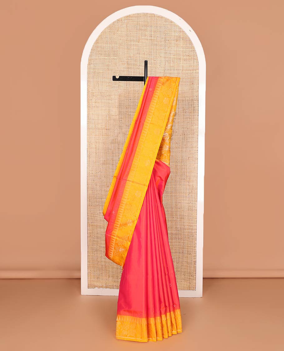 Red zari buttas soft silk saree, contrast temple border of floral designs, and floral design pallu