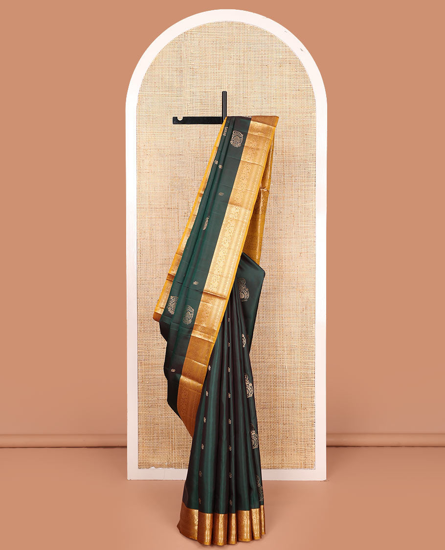 Green zari buttas soft silk saree, contrast border of salngai, muthu, banaras, kodi visiry, rudraksham, and mayil kann, and floral vine pallu