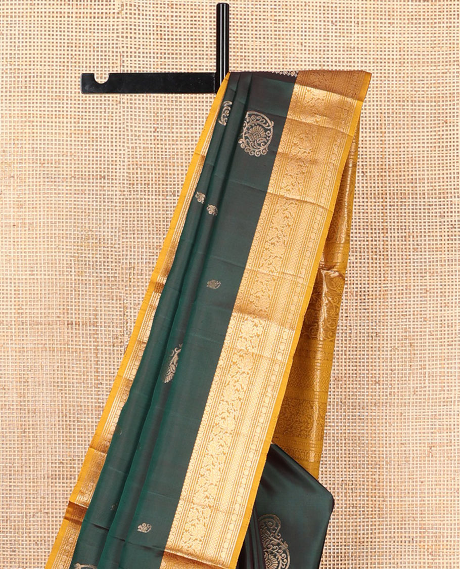 Green zari buttas soft silk saree, contrast border of salngai, muthu, banaras, kodi visiry, rudraksham, and mayil kann, and floral vine pallu